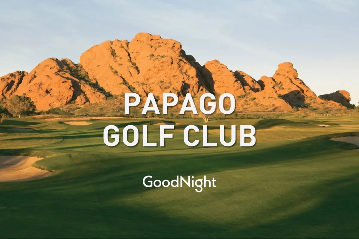 A sweeping view of a lush golf course with dramatic rock formations and immaculate green grass. The serene environment is enhanced by the wide-open space and natural beauty, ideal for both avid golfers and those who appreciate tranquil landscapes.